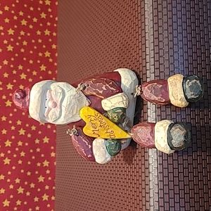 Sitting Resin Santa Holding Heart Merry Christmas